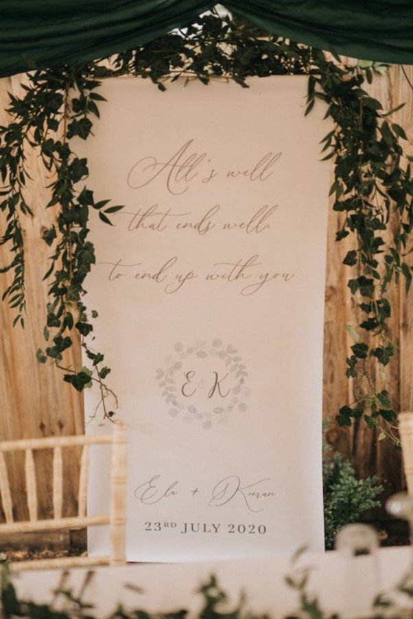 Banner adorned with foliage.